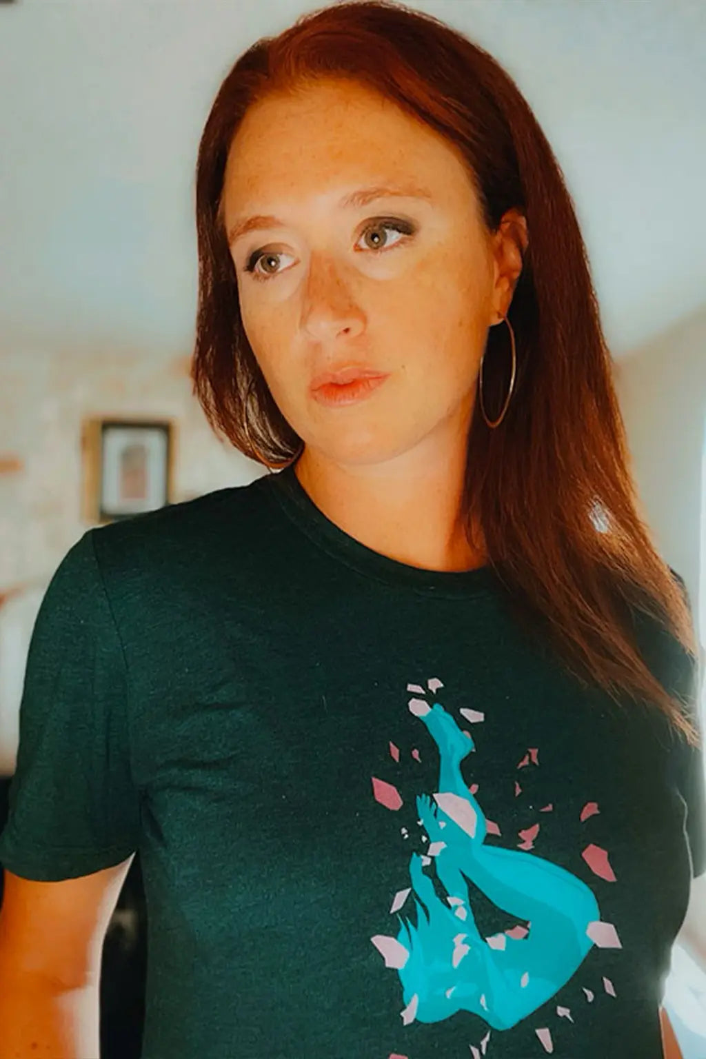 Woman wearing a black t-shirt with a blue graphic design from Cory Cory and Sky Titan