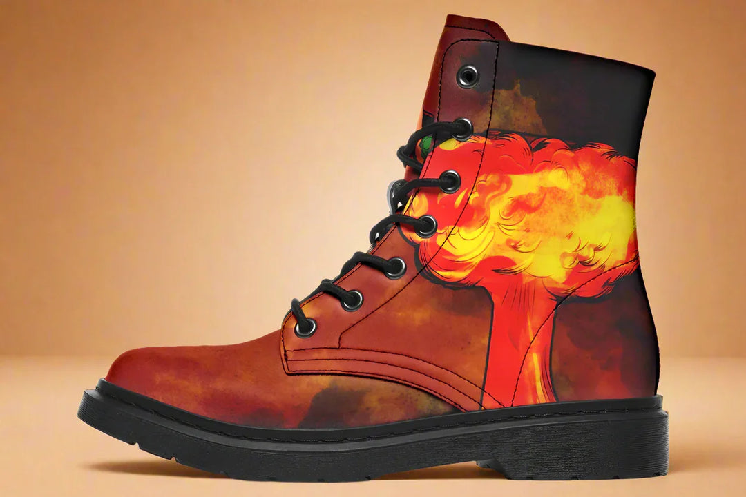 Black lace-up boot featuring a red-orange smoke pattern with an explosion-like burst across the outer side. No figure appears on this panel — just a fiery, abstract blast that adds depth and movement to the canvas. The clean silhouette is framed by black stitching, matte black eyelets, and a rugged black outsole. — Bomber Girl design by Sky Titan Media, combining vintage military-inspired art with edgy, music-fueled streetwear flair.