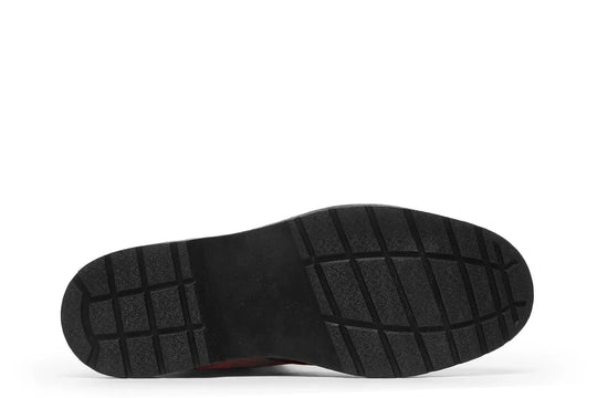 Black lace-up boot featuring a rugged black rubber outsole with deep traction grooves for grip and durability. The outsole has a reinforced heel and forefoot structure, adding to the boot’s tough, street-ready profile. — Bomber Girl design by Sky Titan Media, combining vintage military-inspired art with edgy, music-fueled streetwear flair.