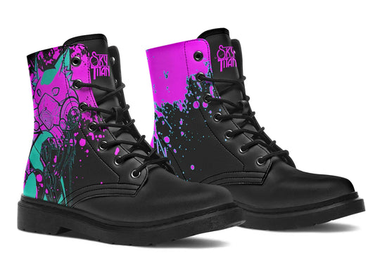 Black lace-up boots with striking pink neon cyber cat artwork on the sides – Cyber Cat Pink Edition by Sky Titan Media, blending fierce futuristic style with bold, music-driven streetwear attitude. Here, both boots reveal the full visual explosion: teal feline contours rise beneath black ink-splatters and electric pink energy. This view captures the unity of design across both sides, pulsing with rhythm, chaos, and cyberstyle confidence.