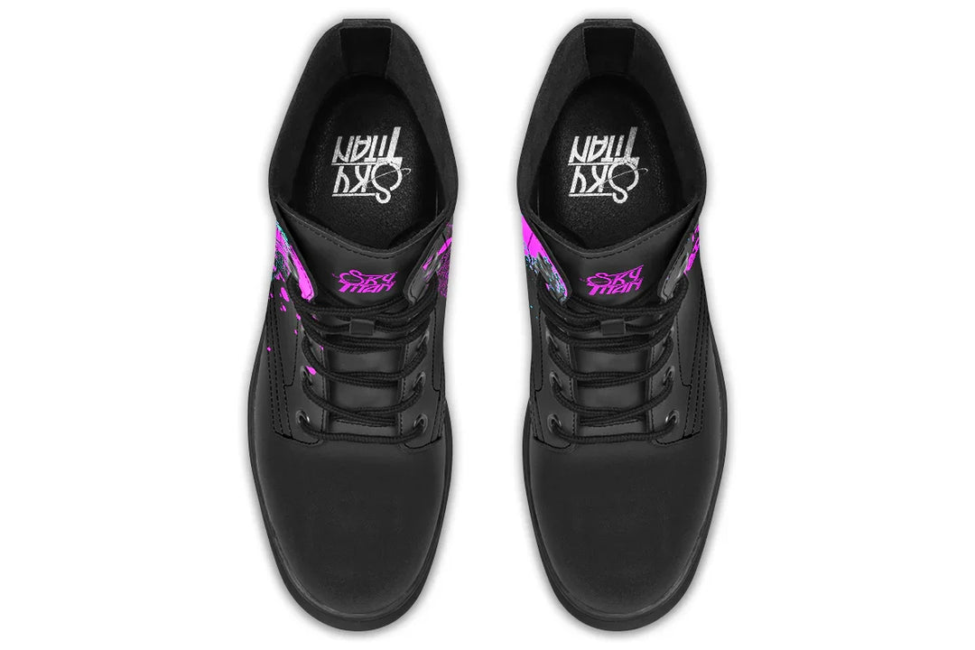 Black lace-up boots with striking pink neon cyber cat artwork on the sides – Cyber Cat Pink Edition by Sky Titan Media, blending fierce futuristic style with bold, music-driven streetwear attitude.
Viewed from above, the padded interior cradles your step while the “Sky Titan” logo stands proudly on the tongue and footbed. The boots maintain symmetry and structure.