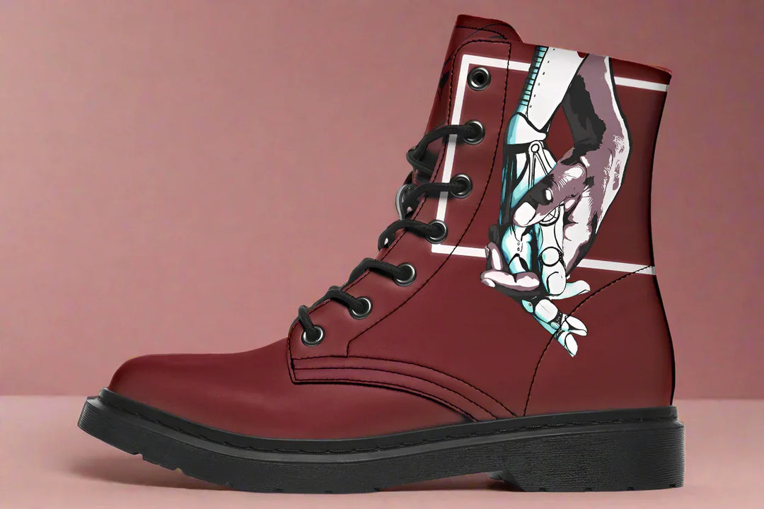 Red lace-up leather boots showcasing expressive line art of two reaching hands from the “July” single cover – July Edition by Sky Titan Media, blending raw emotional symbolism with bold, music-driven streetwear design.This left-side profile features a cropped, framed moment: a boxed graphic appears like a captured flicker of something lost. 
