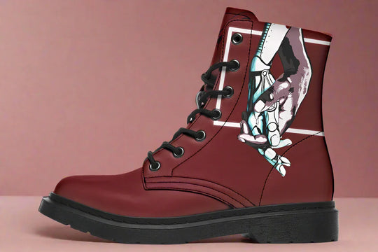 Red lace-up leather boots showcasing expressive line art of two reaching hands from the “July” single cover – July Edition by Sky Titan Media, blending raw emotional symbolism with bold, music-driven streetwear design.This left-side profile features a cropped, framed moment: a boxed graphic appears like a captured flicker of something lost. 