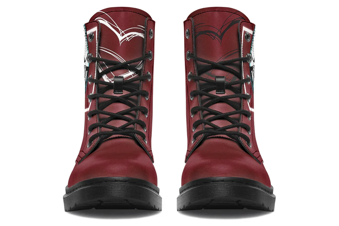 Red lace-up leather boots showcasing expressive line art of two reaching hands from the “July” single cover –  July Edition by Sky Titan Media, blending raw emotional symbolism with bold, music-driven streetwear design.Up front, the black laces cut bold lines across the vibrant red. The tongue features subtle detailing, pulling in the design’s theme of longing without overpowering its simplicity. 