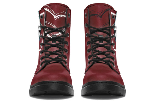 Red lace-up leather boots showcasing expressive line art of two reaching hands from the “July” single cover –  July Edition by Sky Titan Media, blending raw emotional symbolism with bold, music-driven streetwear design.Up front, the black laces cut bold lines across the vibrant red. The tongue features subtle detailing, pulling in the design’s theme of longing without overpowering its simplicity. 