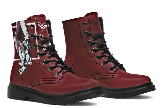 Red lace-up leather boots showcasing expressive line art of two reaching hands from the “July” single cover –  July Edition by Sky Titan Media, blending raw emotional symbolism with bold, music-driven streetwear design.Together, the boots frame a dialogue: the right side holds the full illustration; the left, clean red silence. 