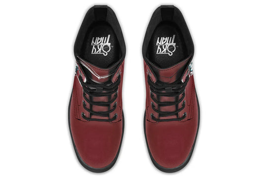 Red lace-up leather boots showcasing expressive line art of two reaching hands from the “July” single cover –  July Edition by Sky Titan Media, blending raw emotional symbolism with bold, music-driven streetwear design.From above, the structured lace system and deep red leather form a clean yet passionate composition. The Sky Titan logo rests inside—minimal, intentional.