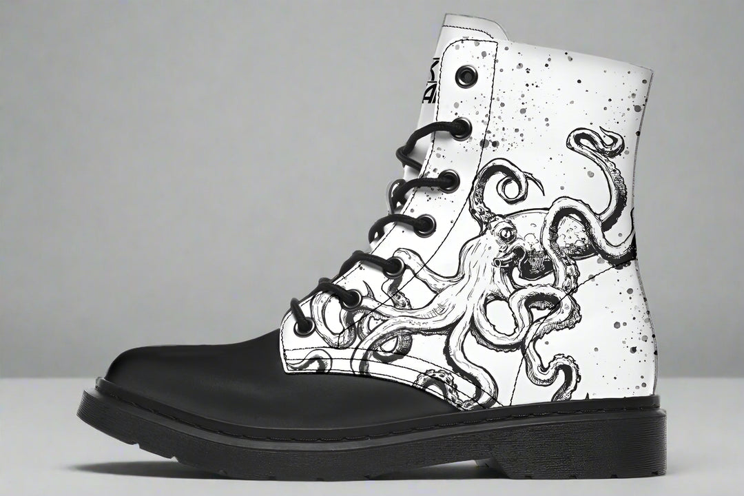 White leather lace-up boot with black octopus ink artwork — part of the Octopus Mismatched Edition by Sky Titan Media, designed for contrast-driven storytelling and wearable asymmetry.The counterpart to its sibling boot, this side is splashed with bold black tentacle strokes that crawl and curve across the white leather. The contrast evokes rebellion, movement, and paradox — clarity wrapped in chaos.