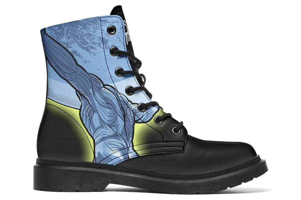 Black lace-up boot showing the continuation of Atlas across the inner side, with the figure’s outstretched arms reaching toward a glowing moon accented by a neon yellow stroke across the opposing boot. The composition creates a mythic arc in motion. — Skybound design by Sky Titan Media, merging mythological strength with rugged, music-inspired streetwear style.
