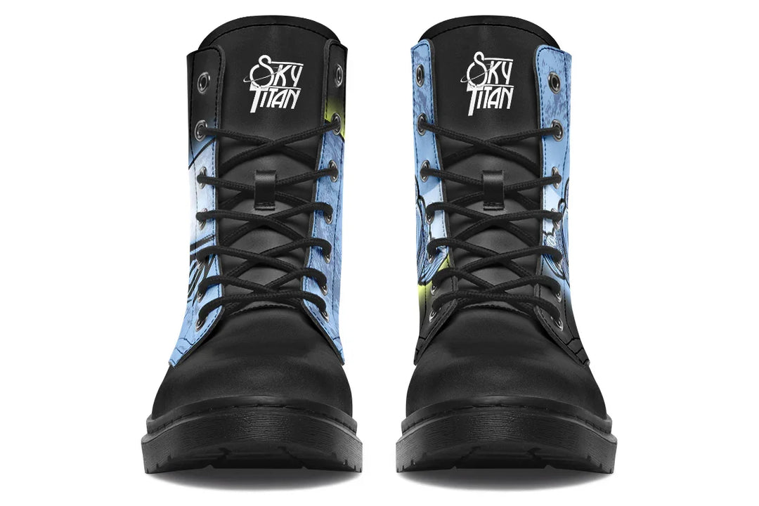 Front view of Skybound lace-up boots featuring rounded black laces threaded through matte black metal eyelets. Both tongues display the Sky Titan logo in crisp white, adding subtle brand identity above the mythic visuals. The clean, rugged silhouette is grounded in cosmic symbolism and streetwise structure. — Skybound design by Sky Titan Media, merging mythological strength with rugged, music-inspired streetwear style.