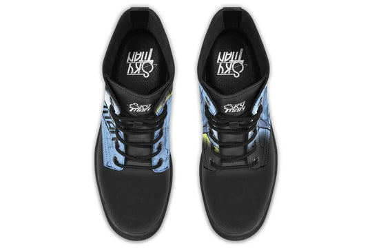 Top view of Skybound boots showing rounded black laces through matte black metal eyelets. Atlas and moon details rise from each tongue panel, while the Sky Titan logo is stamped inside. — Skybound design by Sky Titan Media, merging mythological strength with rugged, music-inspired streetwear style.