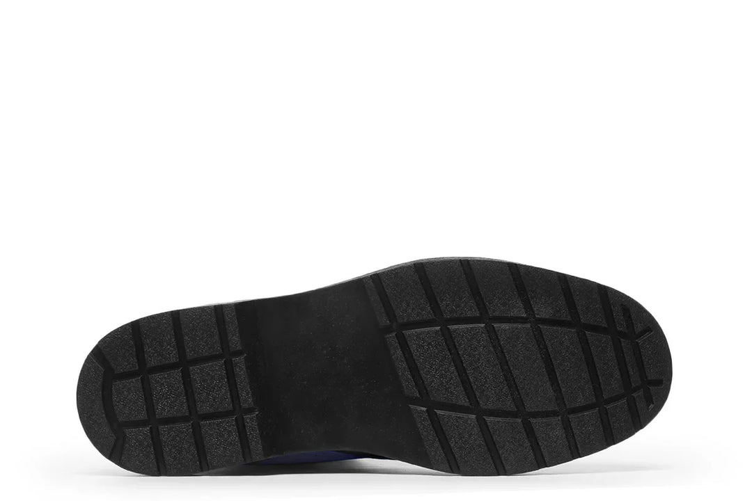 Bottom view of the Skybound lace-up boots showing a rugged black rubber outsole with deep tread patterns for grip and durability. The sturdy foundation mirrors Atlas’s strength — built to carry the weight of the world with every step. — Skybound design by Sky Titan Media, merging mythological strength with rugged, music-inspired streetwear style.