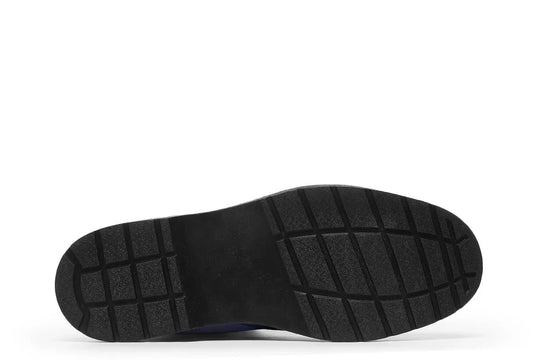 Bottom view of the Skybound lace-up boots showing a rugged black rubber outsole with deep tread patterns for grip and durability. The sturdy foundation mirrors Atlas’s strength — built to carry the weight of the world with every step. — Skybound design by Sky Titan Media, merging mythological strength with rugged, music-inspired streetwear style.