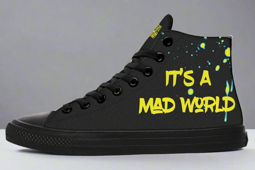 Left-side view of Cyber Cat Yellow Edition sneaker with graffiti-style “It’s A Mad World” text in glowing yellow over black splatter and glitch textures. The left shoe delivers the anthem—“It’s A Mad World” etched in jagged yellow graffiti across matte black chaos. A signature Sky Titan statement that turns rage into art, noise into motion, and rebellion into rhythm.