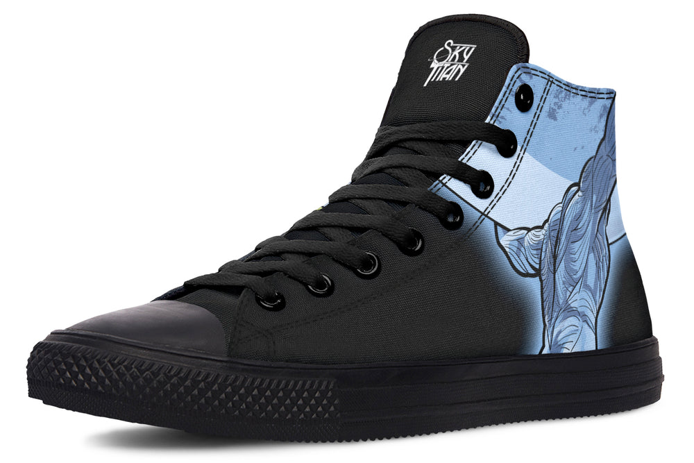 Black high-top sneaker featuring a blue-toned Atlas illustration on the outer side, depicted in comic-book style holding up the sky. The mythic figure brings visual power to the canvas silhouette. — Skybound design by Sky Titan Media, blending mythology-inspired visuals with streetwear rooted in independent music culture.