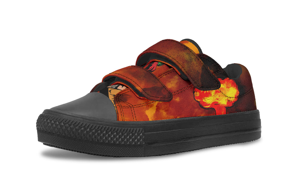 Kids’ low-top sneaker featuring a bright orange-yellow explosion graphic on the outer side of the left shoe. The red-orange smoke blends across the canvas upper, with dual velcro straps and black sole for easy wear and bold style. — Bomber Girl design by Sky Titan Media, made for young adventurers with vintage flair and a fearless sense of style.