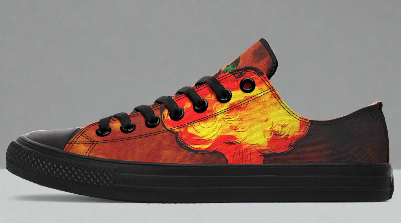 Complementary Black low-top sneaker displaying a more abstract, fiery smoke design in red and orange tones. This balances the boldness of the right shoe by shifting the focus to atmospheric detail — making the Bomber Girl side stand out even more. Matte black sole, toe cap, and laces keep the look sharp.
