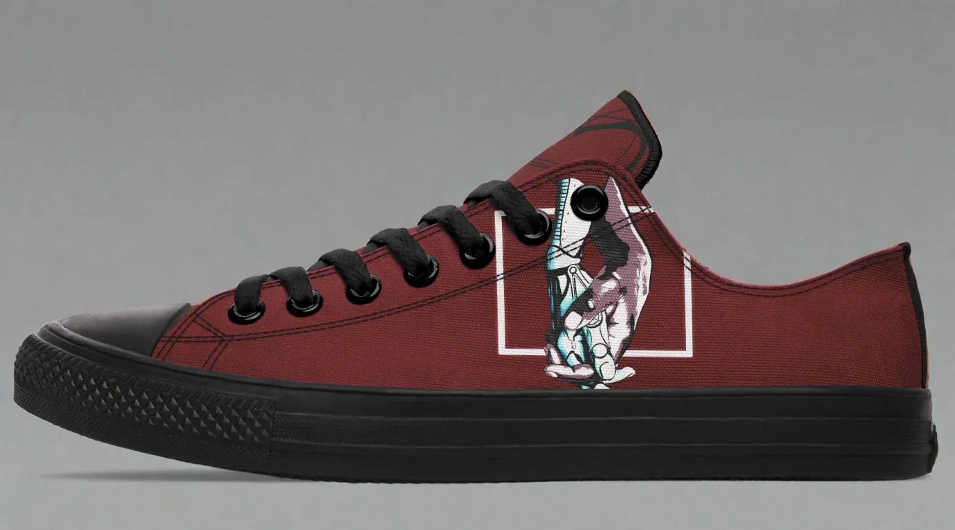 Red low-top sneakers featuring expressive line art of two reaching hands from the “July” single cover — July design by Tatiana Jitkoff and Sky Titan Media, inspired by a sci-fi love story and emotionally driven indie streetwear.