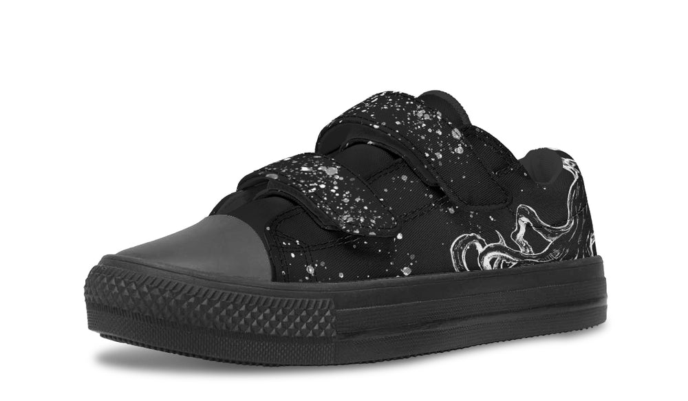 Side profile of the Octopus Blackout low-top sneaker in the kids’ edition by Sky Titan Media, highlighting monochrome tentacle artwork, splatter-effect Velcro straps, and a black rubber sole—bringing deep-sea attitude to everyday playwear.