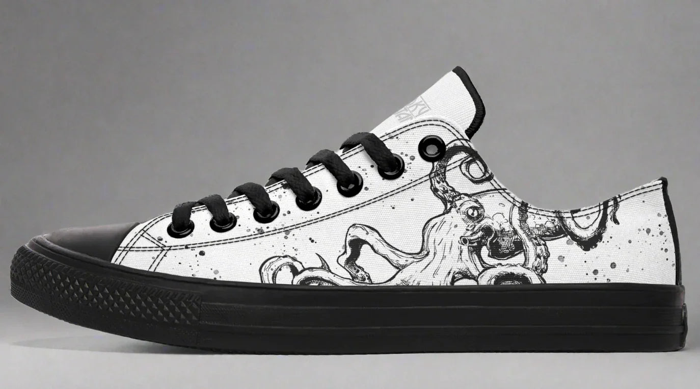 Mismatched low-top sneakers featuring black and white octopus illustrations on each shoe – Octopus Mismatched design by Sky Titan Media, celebrating creativity, contrast, and independent streetwear style.