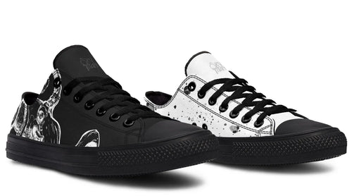 Mismatched low-top sneakers featuring black and white octopus illustrations on each shoe — the Octopus Mismatched design by Sky Titan Media. Styled with a black midsole, laces, and eyelets, this variant adds clean contrast  artwork and splatter patterns flowing across each canvas upper. Blending mythology-inspired visuals with streetwear rooted in independent music culture.