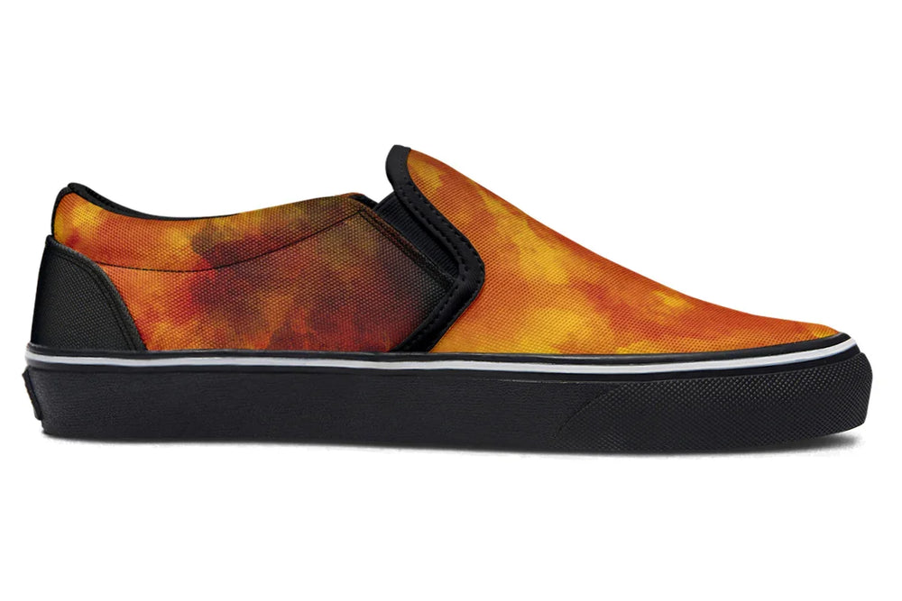 Black slip-on sneakers featuring a full red-orange smoke texture across the inner canvas of both left and right shoes. No illustration or figures appear on the inner panels — just the fiery, explosion-inspired artwork flowing uninterrupted across each side. — Bomber Girl design by Sky Titan Media, merging vintage attitude with edgy, music-fueled streetwear style.