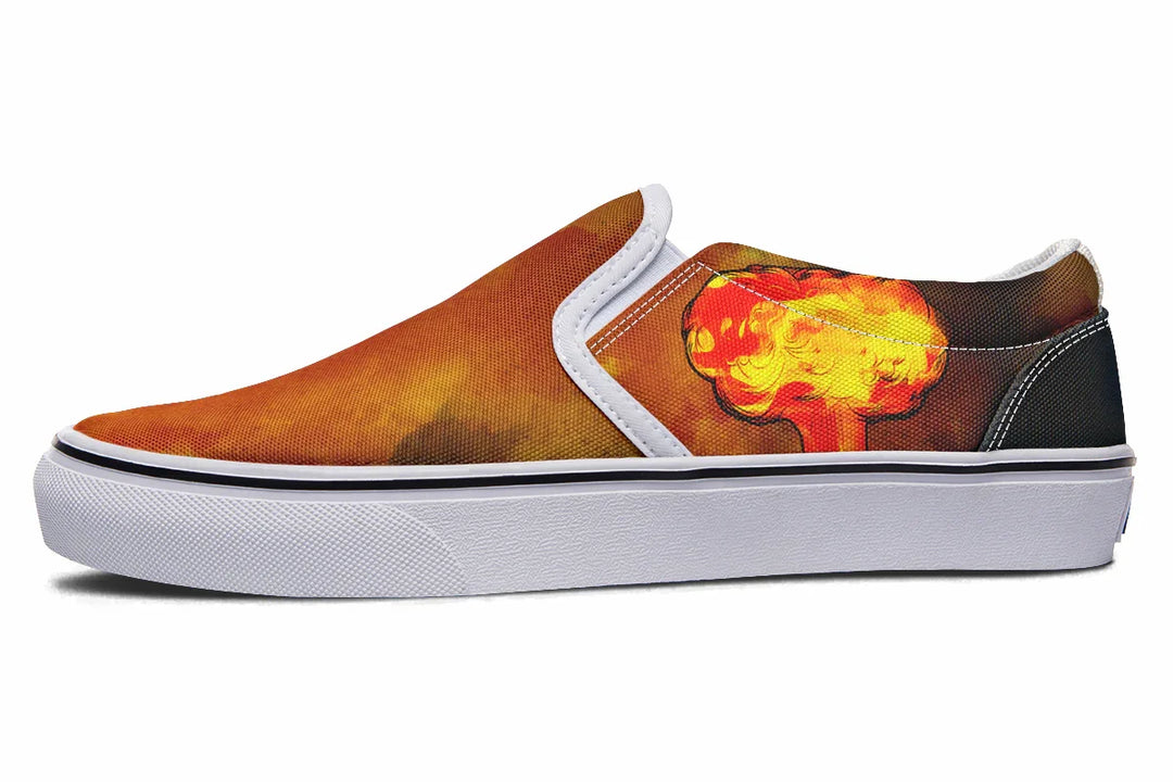 Black slip-on sneaker featuring a red-orange smoke explosion on the outer canvas, framed with white binding and set above a crisp white midsole. A clean contrast that highlights the artwork without overpowering it. — Bomber Girl design by Sky Titan Media, merging vintage attitude with edgy, music-fueled streetwear style.