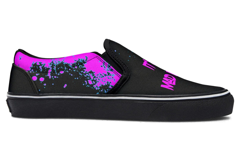 Black slip-on sneakers with bold cyber cat punk artwork and graffiti text – Cyber Cat Pink Edition by Sky Titan Media, blending fierce futuristic style with bold, music-driven streetwear attitude.
The inner panels stay abstract—black canvas splashed with vibrant teal, blue, and hot pink splatter. It keeps the chaos flowing across both shoes without overpowering the statement graphics on the outer sides.