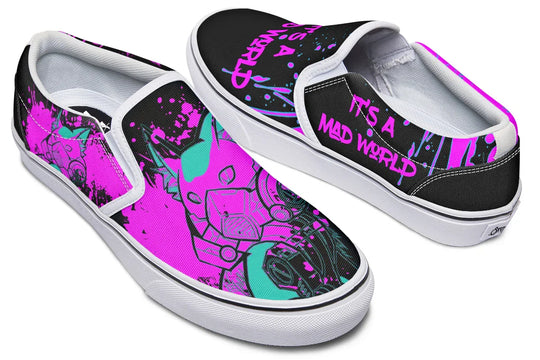 Black slip-on sneakers featuring asymmetrical cyber cat punk artwork and graffiti statements with white detailing — the Cyber Cat Pink Edition by Sky Titan Media, fusing futuristic street rebellion with bold, music-charged expression.
From above, crisp white elastic panels and toe caps punctuate the design: left shoe reads “It’s A Mad World” in graffiti font, while the right hosts a neon pink cyber cat head. Clean contrast elevates every line and brushstroke.