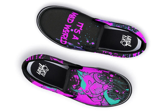 Black slip-on sneakers featuring asymmetrical cyber cat punk artwork and graffiti statements — the Cyber Cat Pink Edition by Sky Titan Media, fusing futuristic street rebellion with bold, music-charged expression.
This top-down view captures the contrasting visuals: the left shoe bears “It’s A Mad World” in graffiti-style pink lettering, while the right features the Cyber Cat Punk head in vibrant neon pink. A split design that commands attention from every angle.