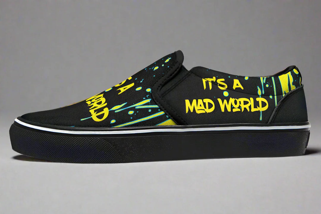 “IT’S A MAD WORLD” stretches across the left shoe’s outer panel in neon graffiti script, backed by electric yellow splatters that echo urban energy and punk attitude. This side screams rebellion. These black slip-on sneakers feature neon yellow cyber cat graphics, graffiti slogans. — Cyber Cat Yellow Edition by Sky Titan Media, built for rebels with futuristic flair and music-fueled streetwear energy.