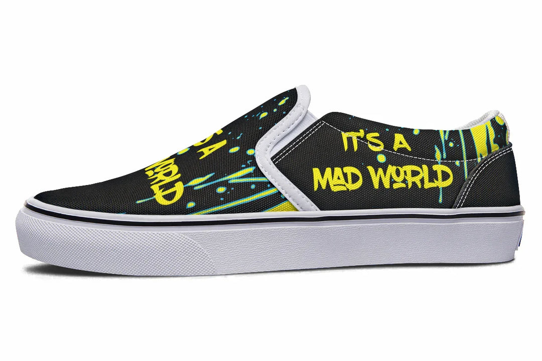 “IT’S A MAD WORLD” blazes across the black canvas in neon graffiti, energized by chaotic yellow paint splatters for a loud, punk-inspired vibe. The clean white sole and stitching ground the frenzy in stylish precision. These black slip-on sneakers feature neon yellow cyber cat graphics and graffiti slogans — Cyber Cat Yellow Edition by Sky Titan Media, built for rebels with futuristic flair and music-fueled streetwear energy.