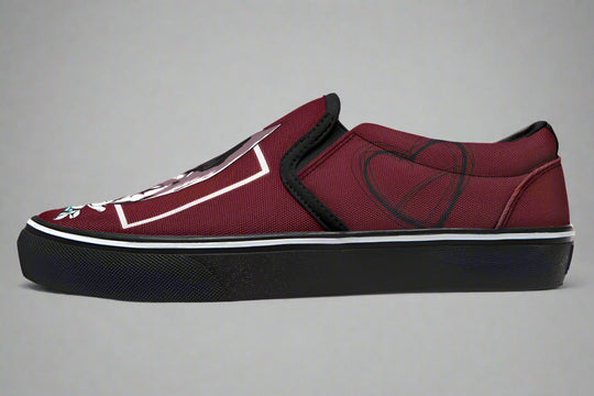 Side profile of the red slip-on sneaker showing heart line art near the heel. The clean black outsole and red canvas upper emphasize the minimalist yet expressive style of the “July” design by Sky Titan Media.