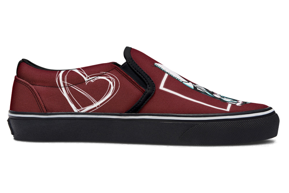 Side profile of the red slip-on sneaker showing heart line art near the heel. The clean black outsole and red canvas upper emphasize the minimalist yet expressive style of the “July” design by Sky Titan Media.