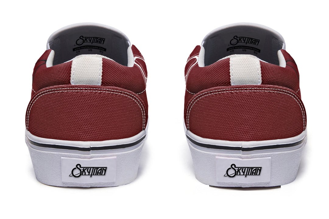 Rear view of the updated “July” slip-ons with clean white soles and distinct heel stitching. Black pull tabs and Sky Titan Media heel branding keep the identity bold, while the white sole color adds a sleek visual upgrade.