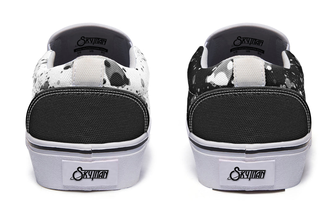 Back view of the Octopus Dual Canvas Edition sneakers showing black and white canvas uppers contrasted by matching white soles and heel tabs – a clean inversion concept rooted in artistic duality.