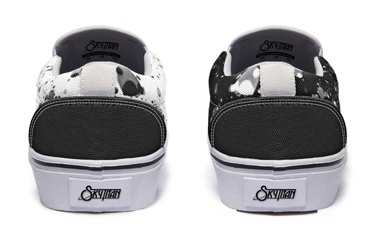 Back view of the Octopus Dual Canvas Edition sneakers showing black and white canvas uppers contrasted by matching white soles and heel tabs – a clean inversion concept rooted in artistic duality.