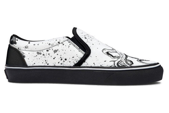 Side view of Sky Titan Media’s Octopus Dual Canvas Edition slip-ons – left shoe in white canvas with black octopus design, right shoe in black canvas with white octopus art, both unified by black soles and creative energy.