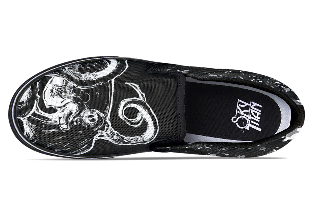 Top-down look at mismatched Octopus Dual Canvas Edition sneakers, highlighting mirrored black-and-white octopus graphics and splatter detailing for a split-yet-balanced artistic statement.