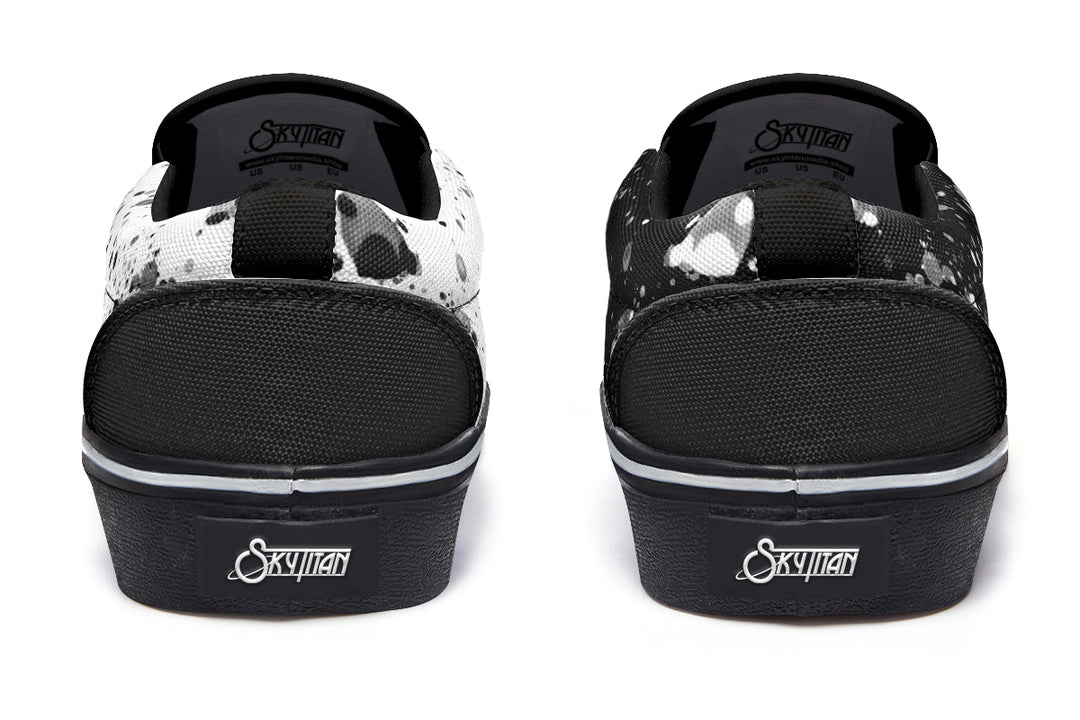 Back view of the Octopus Dual Canvas Edition sneakers showing color inversion between each shoe, with clean heel lines and a shared black sole grounding the creative split.