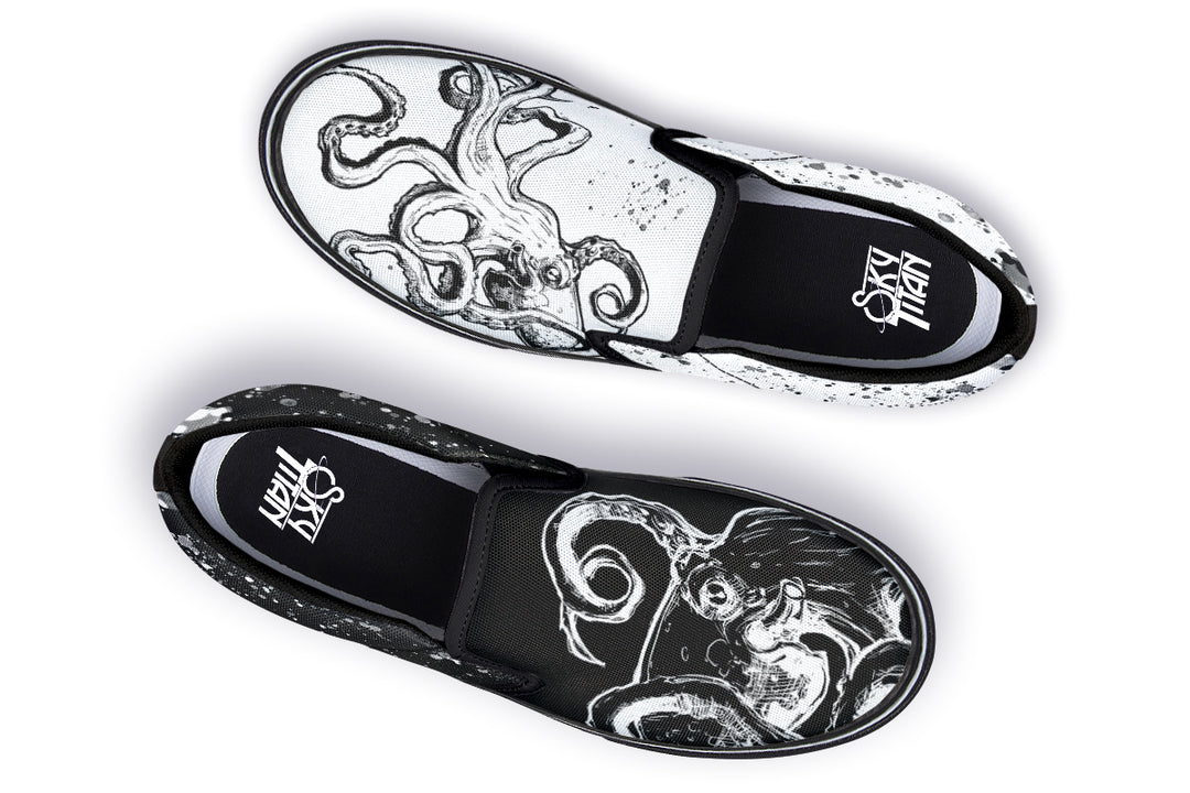 Flat lay of the Octopus Dual Canvas Edition slip-ons by Sky Titan Media – one black with white artwork, the other white with black art, creating visual harmony through contrast and hand-detailed design.