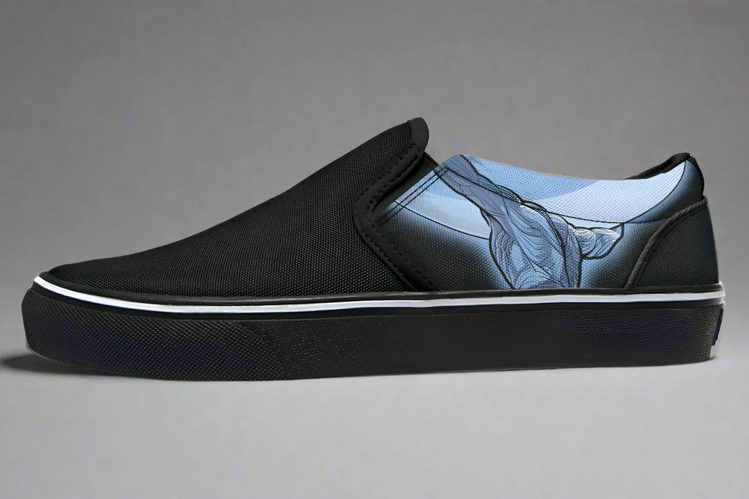 Black slip-on sneaker featuring a comic-style illustration of Atlas in blue tones, shown lifting the sky with strength and symbolism. The artwork covers the outer canvas, pairing mythic struggle with modern edge. — Skybound design by Sky Titan Media, blending mythology-inspired visuals with streetwear rooted in independent music culture.