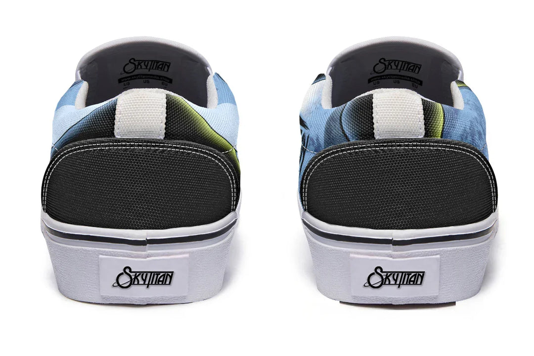 Rear view of Skybound slip-ons with reinforced heels and wraparound art subtly merging Atlas and moon motifs. White midsoles and trim define the structure, grounding the celestial visuals. — Skybound design by Sky Titan Media, blending mythology-inspired visuals with streetwear rooted in independent music culture.