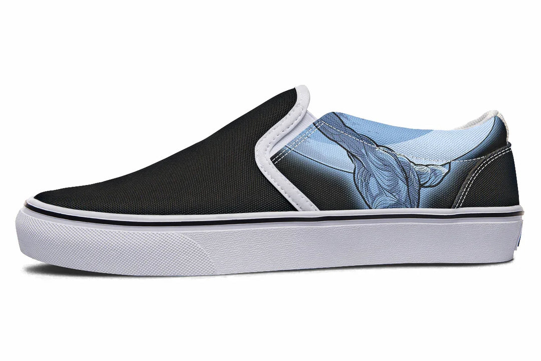 Black slip-on sneaker with white trim and sole, featuring a comic-style illustration of Atlas in blue tones, shown lifting the sky with strength and symbolism. The artwork spans the outer canvas, pairing mythic struggle with modern edge. — Skybound design by Sky Titan Media, blending mythology-inspired visuals with streetwear rooted in independent music culture.