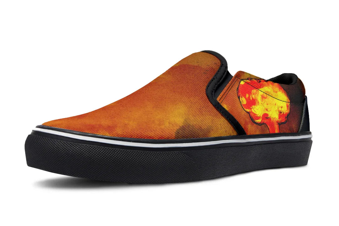 Black slip-on sneaker featuring a red-orange smoke explosion blast on the outer canvas of the left shoe, with no figure artwork. Framed in black trim and grounded by a clean black sole — Bomber Girl design by Sky Titan Media, merging vintage attitude with edgy, music-fueled streetwear style.