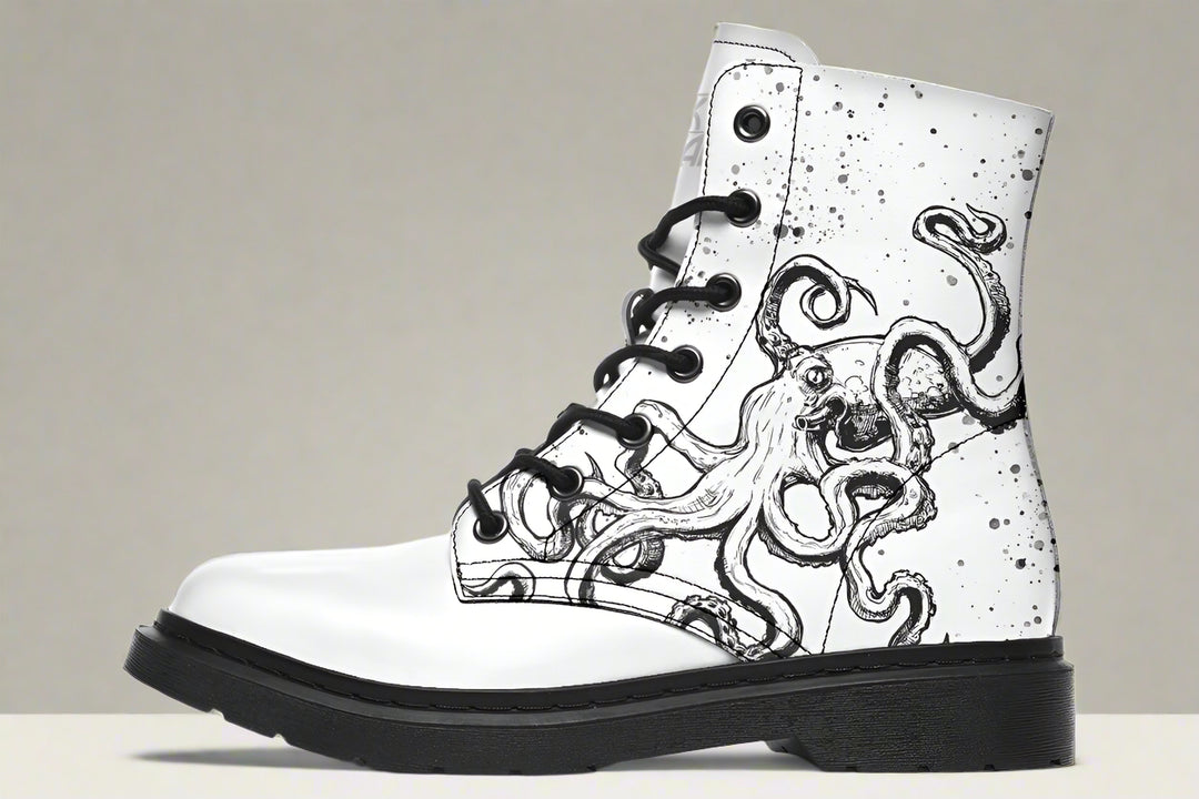 White leather lace-up boots with black octopus ink artwork — Octopus White Out Edition by Sky Titan Media, designed for pristine rebellion, visual clarity, and indie-edge storytelling.This side explodes with energy: ink-like tentacles stretch in flowing precision across white leather. The contrast is deliberate — a visual jolt that evokes emotion while keeping the form wearable.